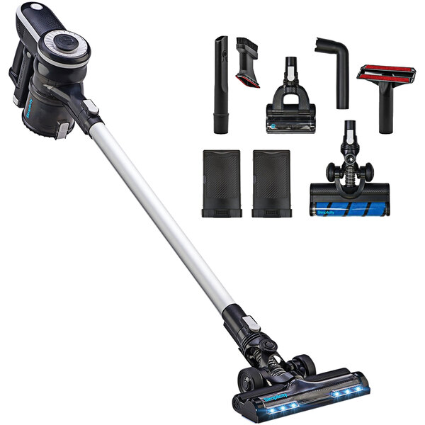 A Simplicity S65P cordless stick vacuum with various attachments and accessories.