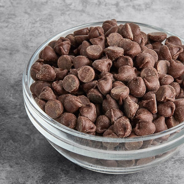 A glass bowl filled with semi-sweet chocolate baking chips.