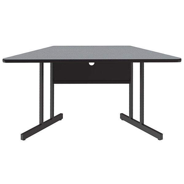 A trapezoid table with a gray granite finish.