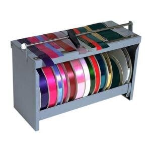 A metal Bulman ribbon dispenser with colorful ribbons on it.