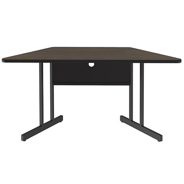 A Correll trapezoid desk with a wood surface.