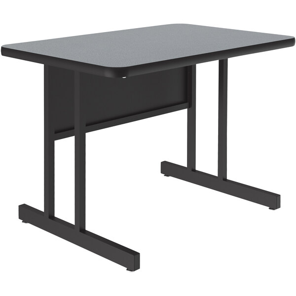 A black rectangular Correll computer desk with black legs and a grey granite finish top.