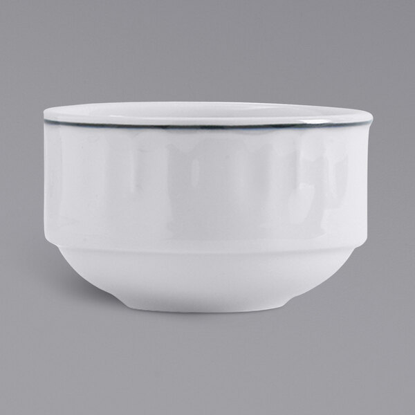 A white bouillon cup with a blue band.