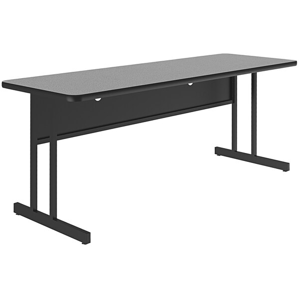 A gray granite finish Correll rectangular desk top on a black desk with black legs.