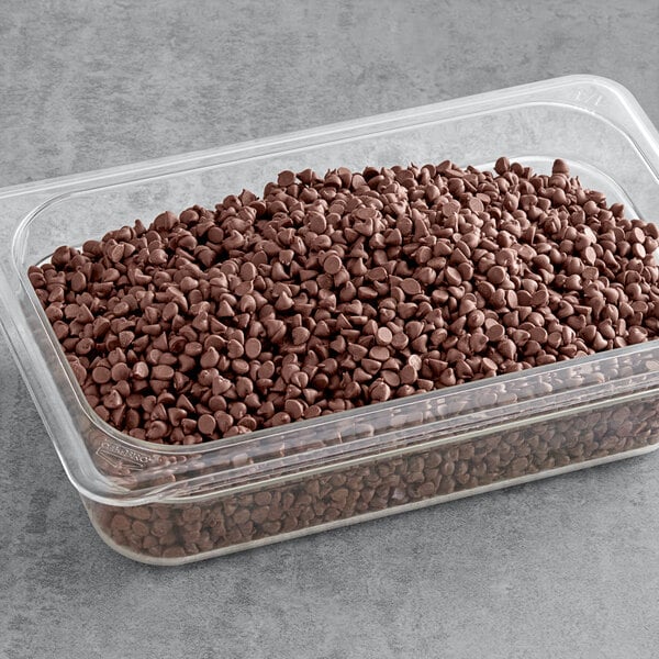 A resealable plastic bag of HERSHEY'S Semi-Sweet Mini Chocolate Chips on a counter.