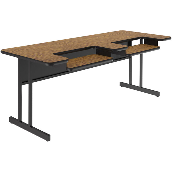 A Correll medium oak computer desk with two shelves.