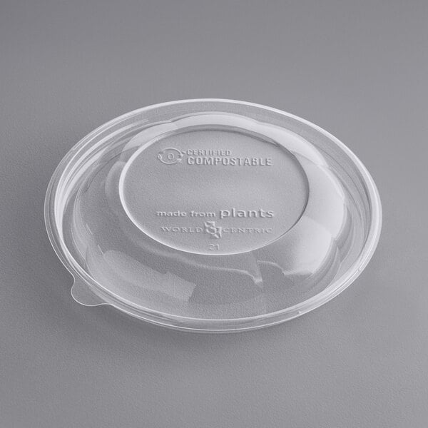 A World Centric clear plastic dome lid on a plastic container.