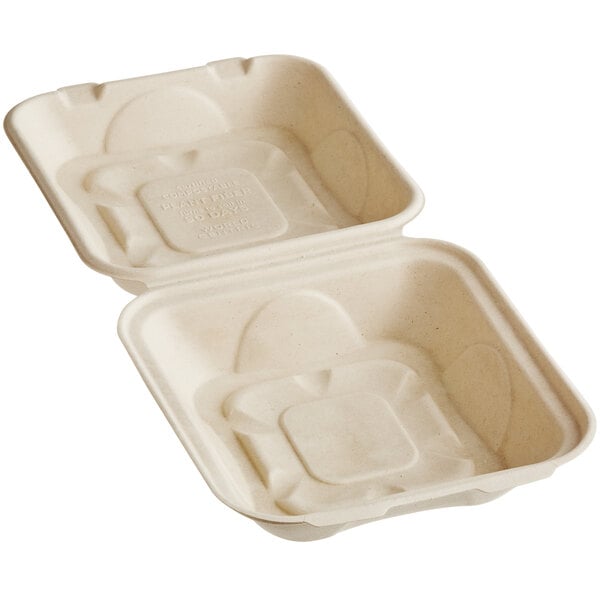 A white World Centric compostable fiber clamshell container with text on it.