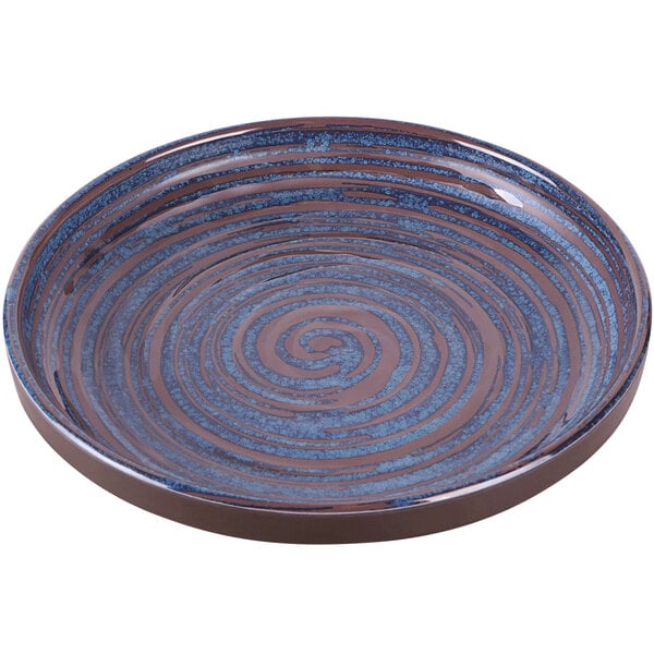 An Elite Global Solutions blue and brown melamine coupe plate with a swirl design.