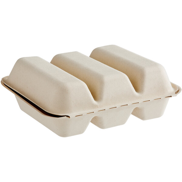 A white World Centric compostable fiber clamshell with three compartments.