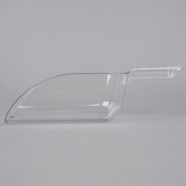 A clear plastic scoop with a handle.