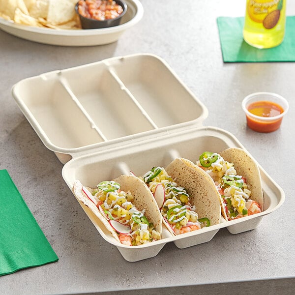 A white World Centric 3-compartment taco container with two tacos, tortillas, and salsa.