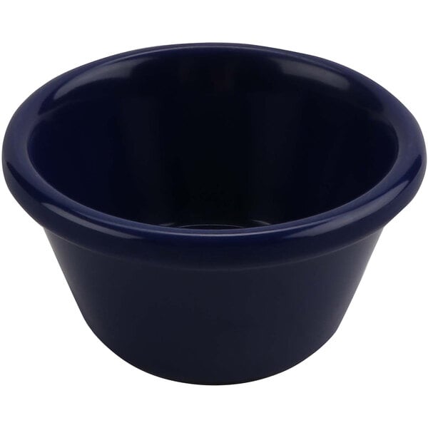 A cobalt blue smooth melamine ramekin.