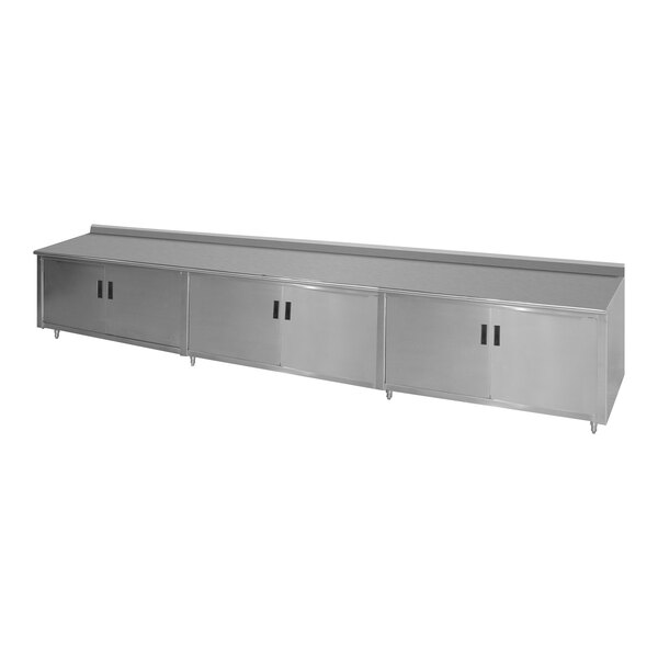 A stainless steel enclosed base work table with a fixed midshelf.