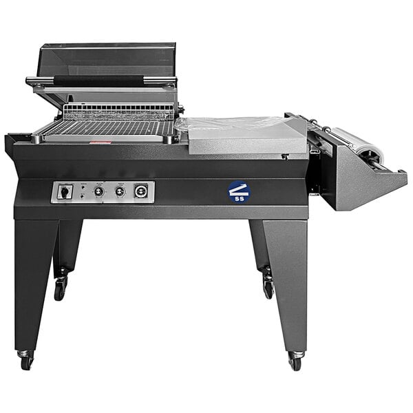 A Sealer Sales compact L-bar sealer with a hooded shrink chamber on wheels with a lid open over a table.