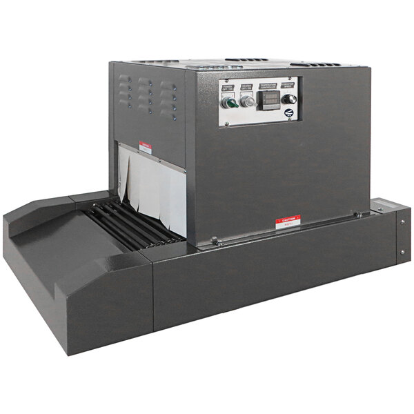 A large grey Sealer Sales shrink tunnel machine with buttons and switches.