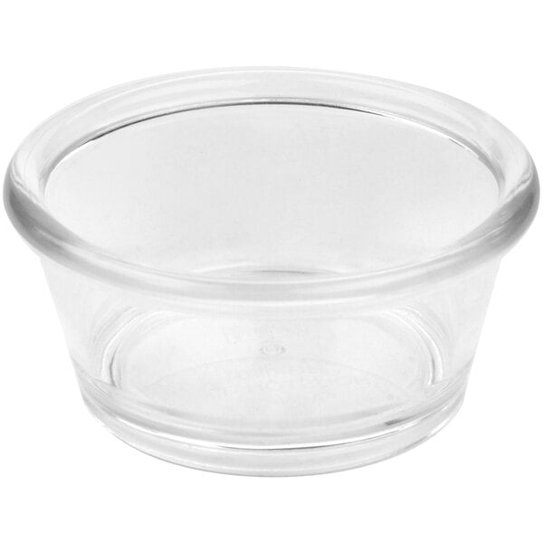 A close up of a clear plastic GET ramekin with a round rim.