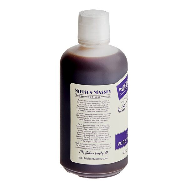 A close-up of a 32 fl. oz. bottle of Nielsen-Massey Ugandan Vanilla Extract with white and purple labels.