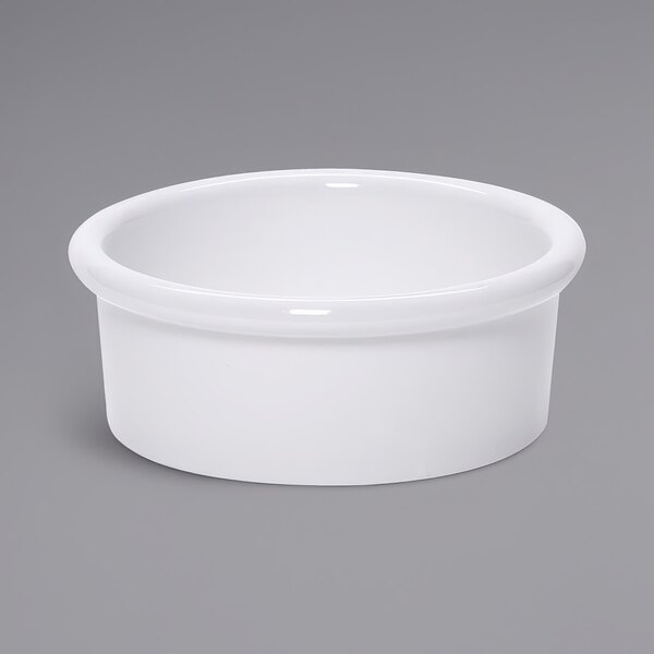 A white GET ramekin on a white surface.