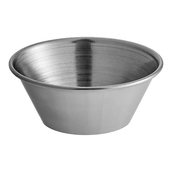 A close-up of a silver stainless steel GET condiment cup.