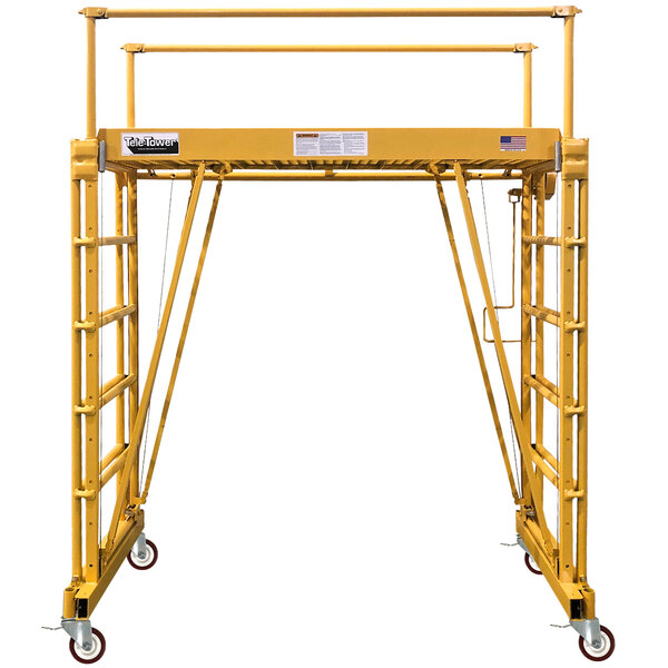 A yellow Paragon Pro Tele-Tower scaffolding platform with wheels.