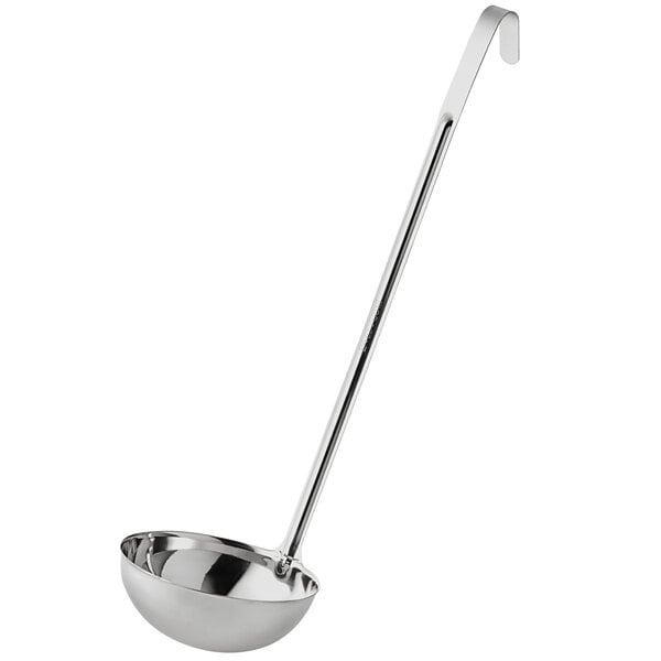 A silver ladle with a long handle.