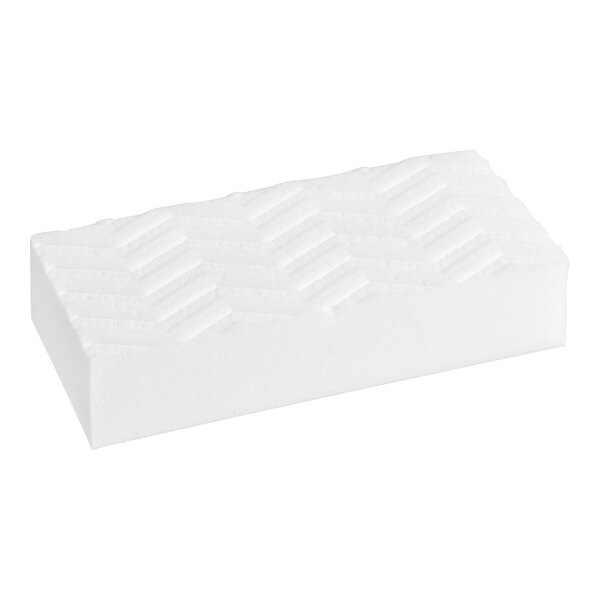 A white rectangular Mr. Clean Magic Eraser with a pattern.