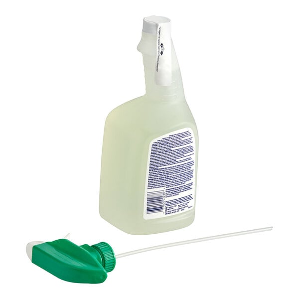 A close-up of a Comet all purpose cleaner bottle with green accents.