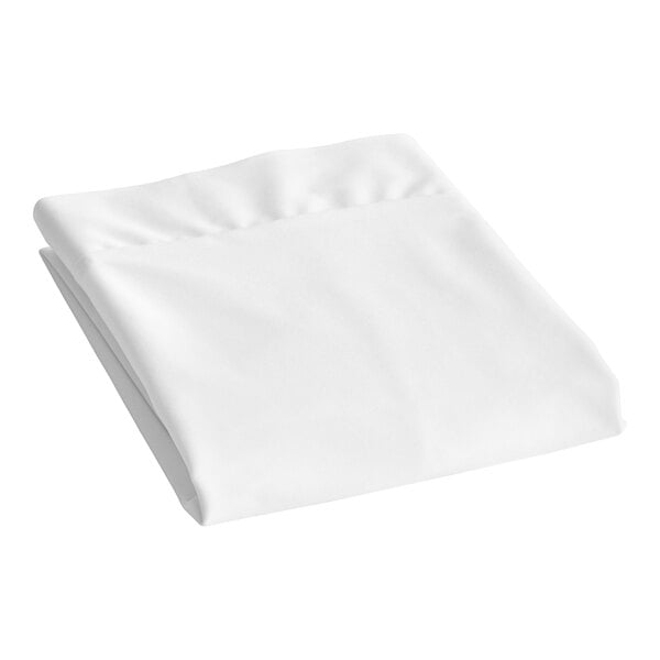 A folded white CleanRest PRO Max pillow protector on a white surface.