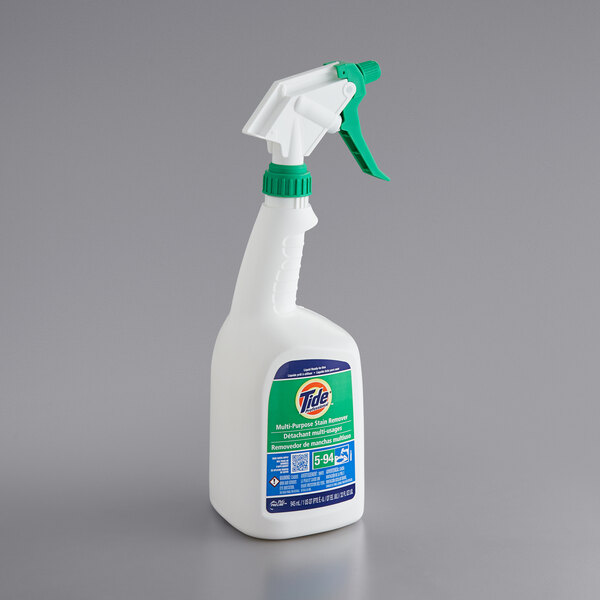 A white bottle of Tide Professional Multi-Purpose Stain Remover with a green cap.