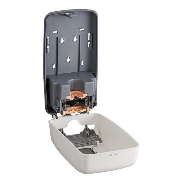 A white plastic Safeguard professional dispenser with a grey plastic tray.