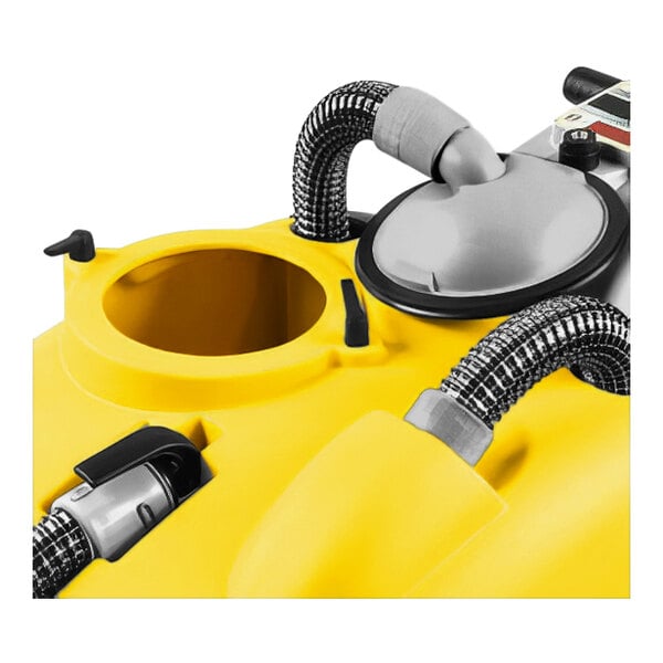 A yellow and grey Tornado walk behind cylindrical floor scrubber with hoses.