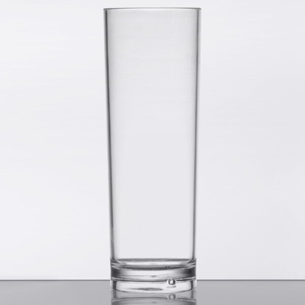 A clear GET Tom Collins glass filled with a clear liquid.