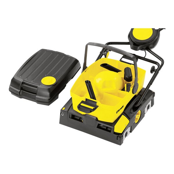 A yellow and black Tornado walk behind cylindrical floor scrubber.