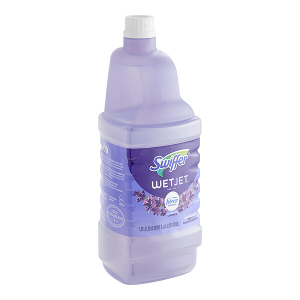 A close-up of a Swiffer WetJet Multi-Surface Cleaner Solution Refill bottle with purple liquid and a lavender label.