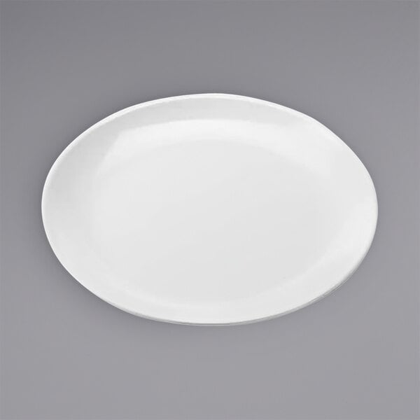 An American Metalcraft white melamine plate with a small rim on a gray surface.