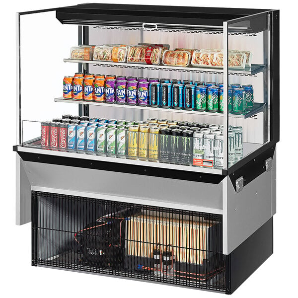 A Turbo Air drop-in refrigerated display case with drinks and beverages on shelves.