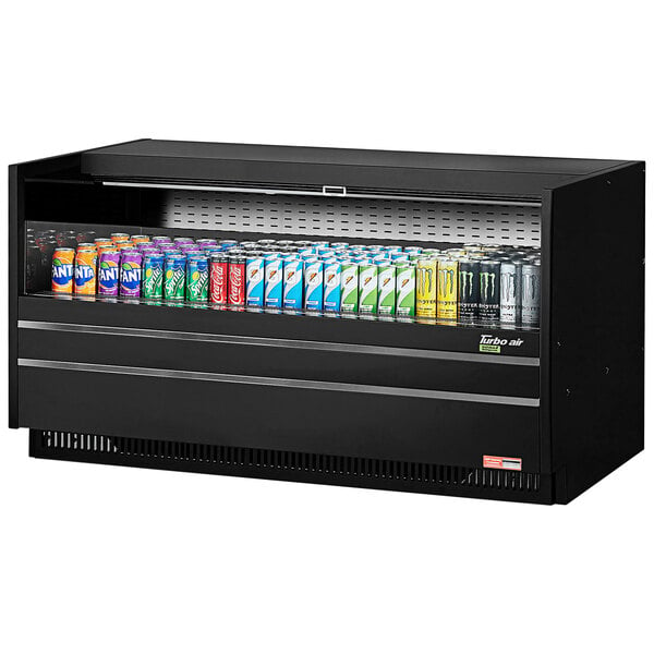 A Turbo Air black drop-in refrigerated display case with several cans of soda.