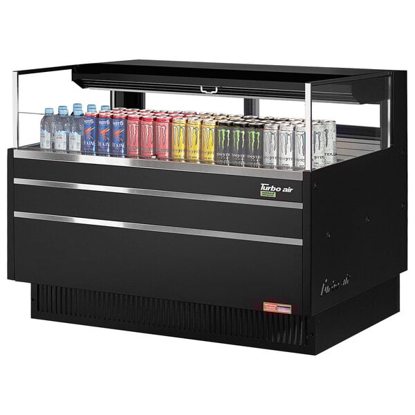 A black Turbo Air horizontal refrigerated open curtain merchandiser with drinks and cans inside.