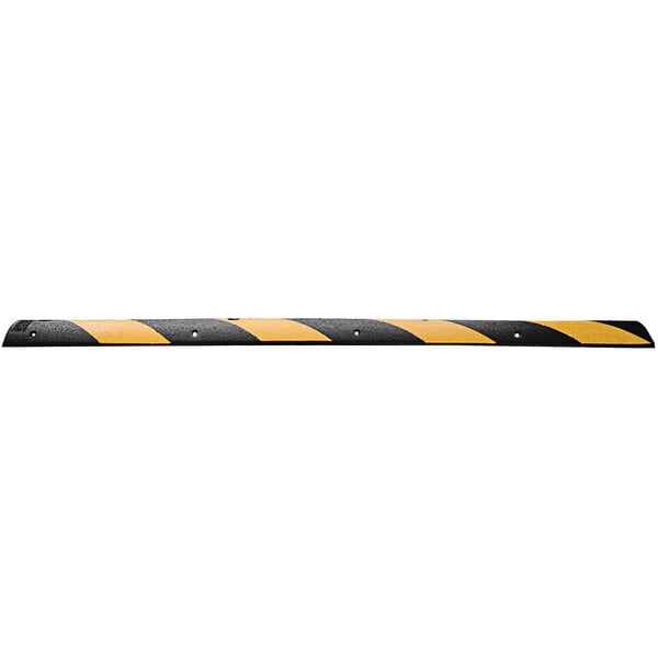 A Cortina black rubber speed bump with yellow reflective strips.