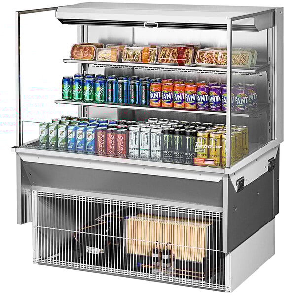 A Turbo Air drop-in refrigerated display case with drinks and cans on shelves.