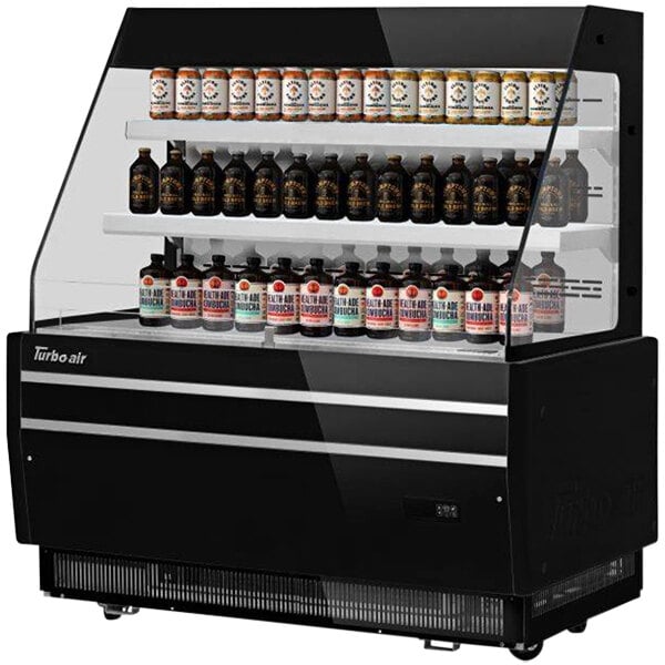 A black Turbo Air display case with bottles on shelves.