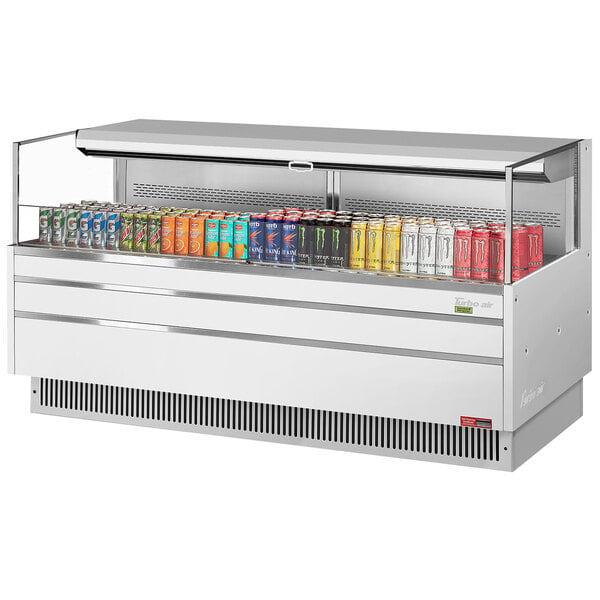 A white Turbo Air refrigerated open curtain merchandiser full of energy drinks.