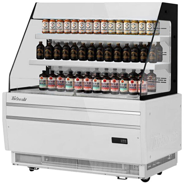 A white Turbo Air horizontal refrigerated display case with shelves of bottles and cans.