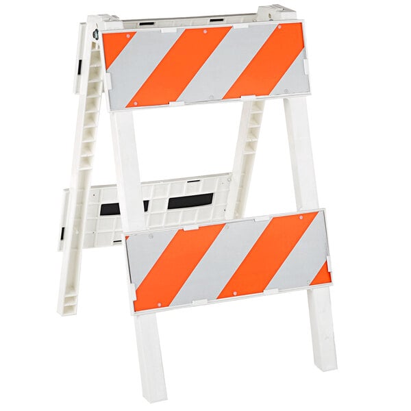 A white and orange Cortina Plastx reflective barricade with white and orange stripes.