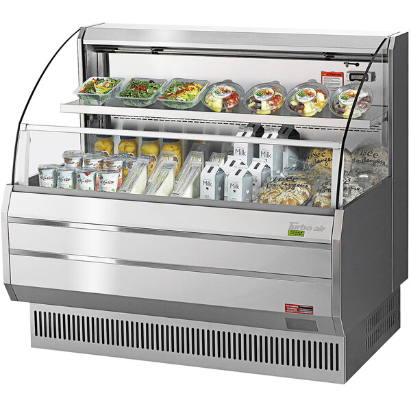 A Turbo Air stainless steel horizontal refrigerated open low profile curtain merchandiser with food inside.