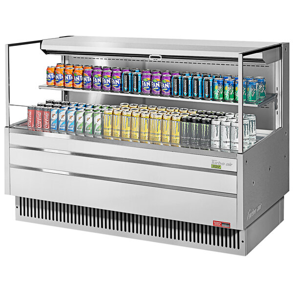 A Turbo Air refrigerated curtain merchandiser with drinks on the shelves.