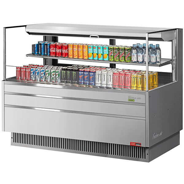 A Turbo Air horizontal refrigerated open curtain merchandiser with drinks and cans inside.