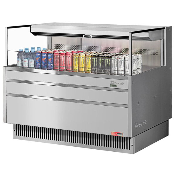 A Turbo Air stainless steel horizontal refrigerated curtain merchandiser with drinks inside.