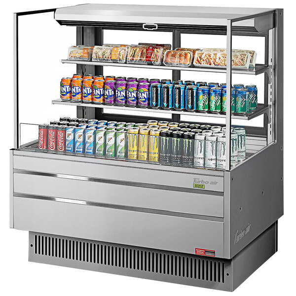 A Turbo Air stainless steel horizontal refrigerated display case with drinks and beverages.